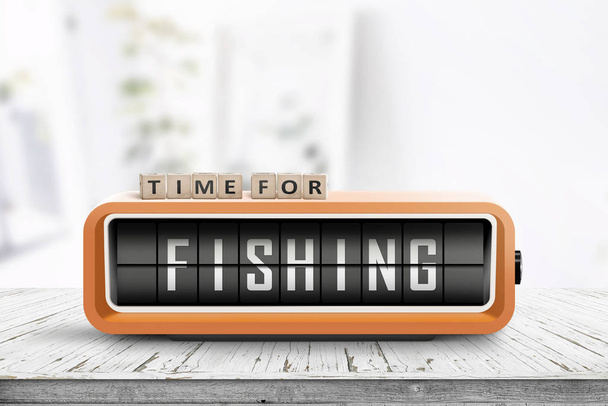 Relógio de alarme retro com a palavra pesca em uma mesa de madeira em um quarto brilhante
 - Foto, Imagem