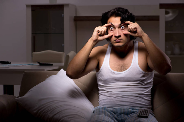 Young man suffering at home night time - Photo, Image
