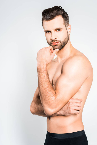 handsome bearded shirtless man posing isolated on grey - Foto, imagen