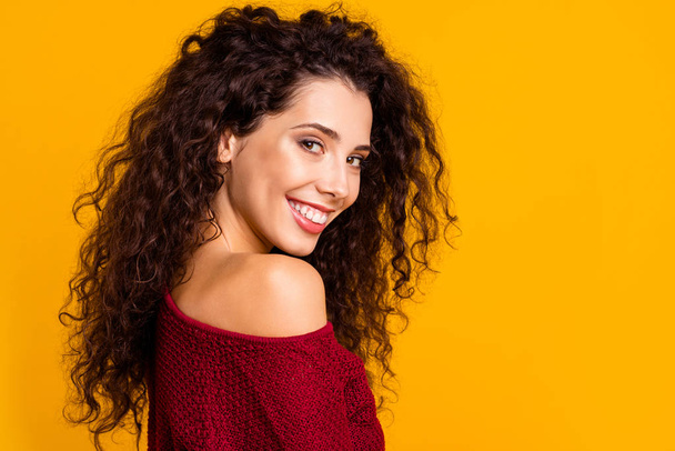 Close up side profile view photo amazing her she lady nude naked shoulder revealed teeth playful look wearing red knitted sweater pullover clothes outfit isolated yellow background - Foto, afbeelding