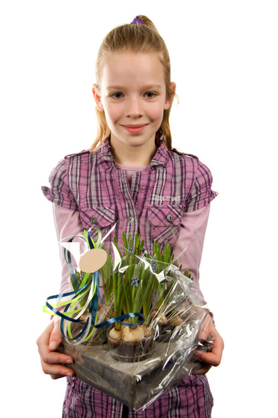 Young blonde girl with flowers - Foto, afbeelding