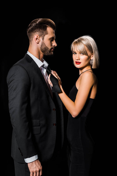 attractive glamour couple posing isolated on black - Foto, immagini