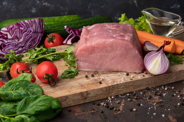 Ingredients for stew cooking: raw meat, herbs,spices,vegetables and  salt on rustic cutting board, copy space - Foto, immagini