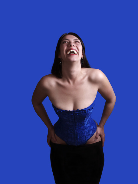 Smiling Woman in Blue Corset Skirt Pulled Down - Zdjęcie, obraz