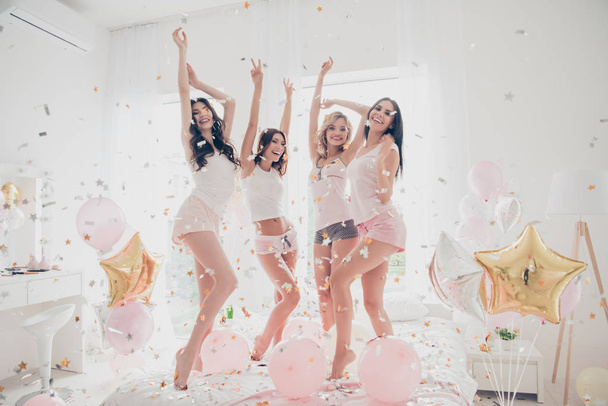 Full length body size portrait of nice-looking attractive feminine charming fit thin slim graceful cheerful cheery girlfriends having fun showing v-sign in light white interior decorated house - Φωτογραφία, εικόνα