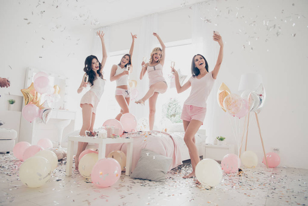 Full length body size portrait of nice-looking cool crazy careless attractive charming fit thin slim graceful cheerful girlfriends having fun making selfie in light white interior decorated house - Fotó, kép