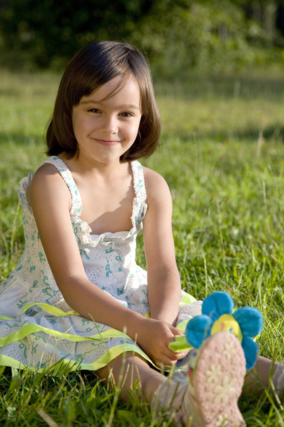 Lovely little girl on green grass - Fotografie, Obrázek