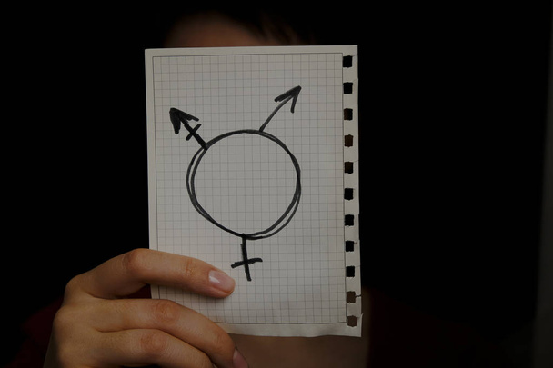 Transgender-Symbol auf schwarzem Hintergrund in Großaufnahme - Foto, Bild
