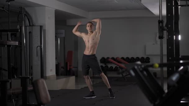 Man showing his muscles - Materiaali, video