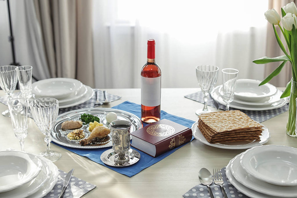 Table served for Passover (Pesach) Seder indoors - Foto, Imagen