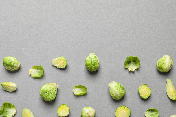 Tasty fresh Brussels sprouts on grey background, top view with space for text - Zdjęcie, obraz