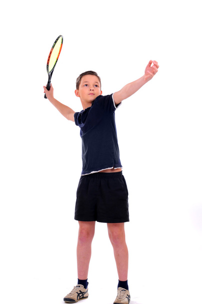 Child with a tennis racket isolated on a white - Фото, зображення