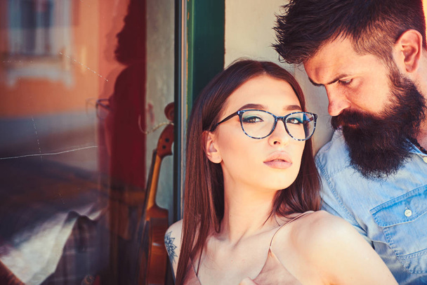 Fashion is about good attitude. Girlfriend and boyfriend in relations of friendship. Couple of lovers with fashion style. Couple in love. Sexy woman and bearded man in love relations. Fashion models - 写真・画像