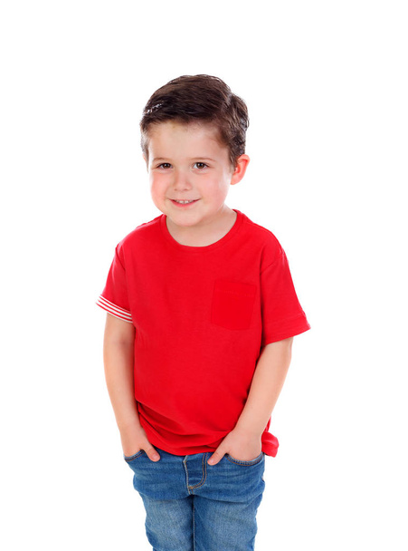 Gracioso niño pequeño con cabello oscuro y ojos negros cruzando sus brazos aislados sobre un fondo blanco
 - Foto, imagen