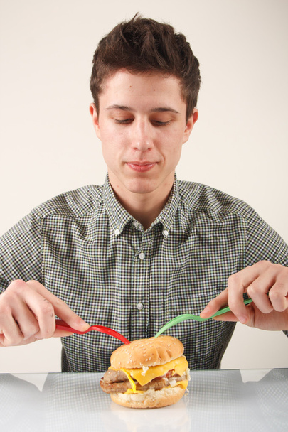 Man eating hamburger - Fotó, kép