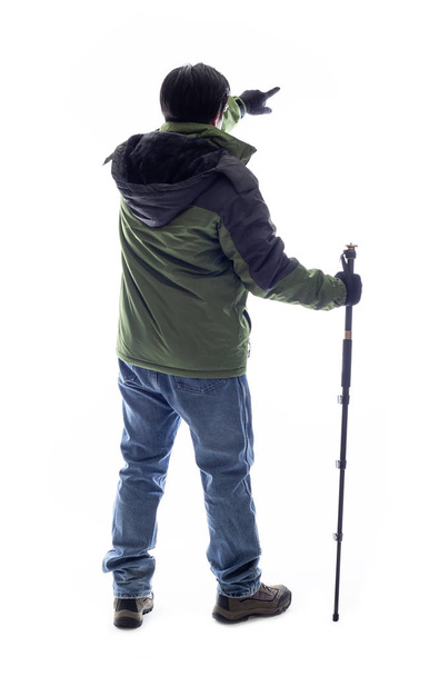 Mountain Climber or Hiker looking at a white background for composite.  The man is isolated and acting like he is looking at a view to depict outdoor activity and adventure. - Foto, immagini