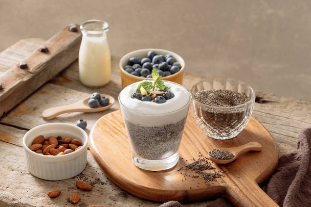 Chia pudding with berries and milk, sweet nourishing dessert, healthy breakfast superfood concept - Foto, Imagen