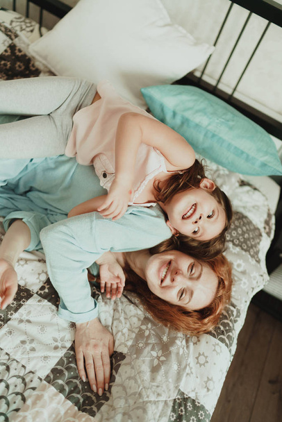 cozy photo session of beautiful happy mother and daughter, indoor - Foto, Imagem
