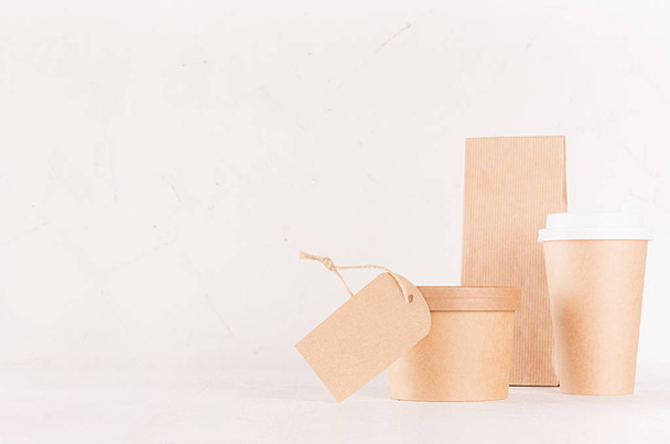Fast food template for branding identity - blank disposable brown paper coffee cup, label, box for soup or ice cream, pack  on white wood table, copy space. - Photo, Image