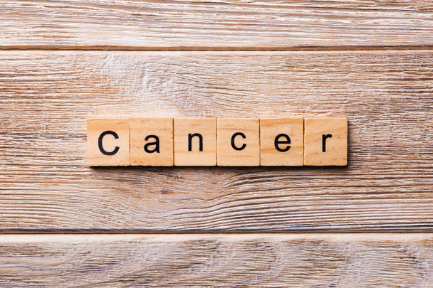 CANCER word written on wood block. CANCER text on wooden table for your desing, concept. - Foto, Imagem