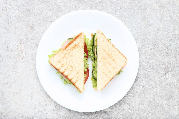 Tasty sandwiches with vegetables in plate - Zdjęcie, obraz