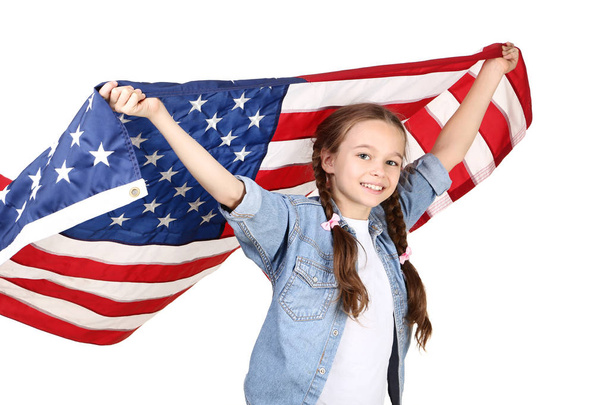 Young girl holding an American flag on white background - Foto, immagini