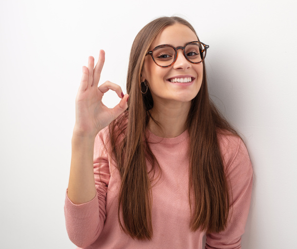 Young cute woman cheerful and confident doing ok gesture - Fotoğraf, Görsel