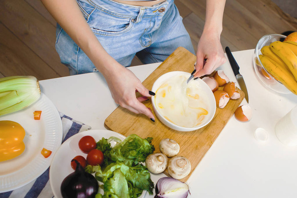 woman cooking at domestic kitchen, selective focus - Фото, изображение