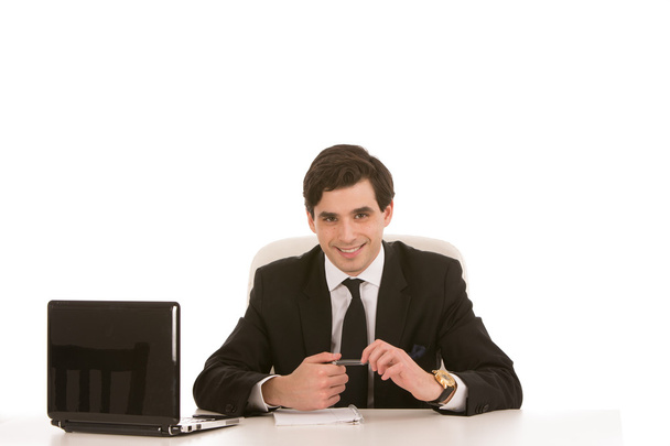 Successful businessman seated at his desk - Fotoğraf, Görsel