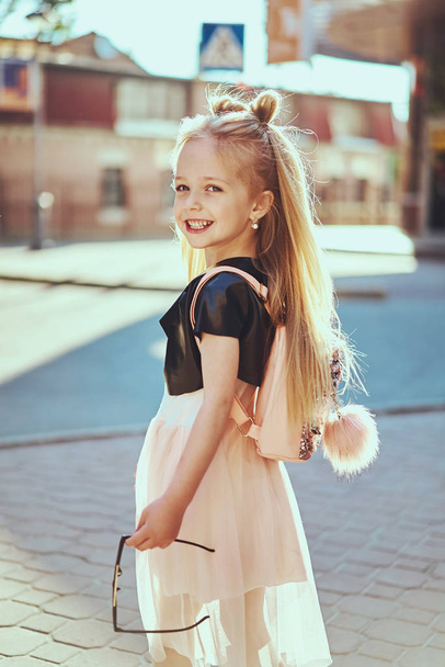 Adorable toddler girl wearing pink dress. Fashion portrait - Zdjęcie, obraz