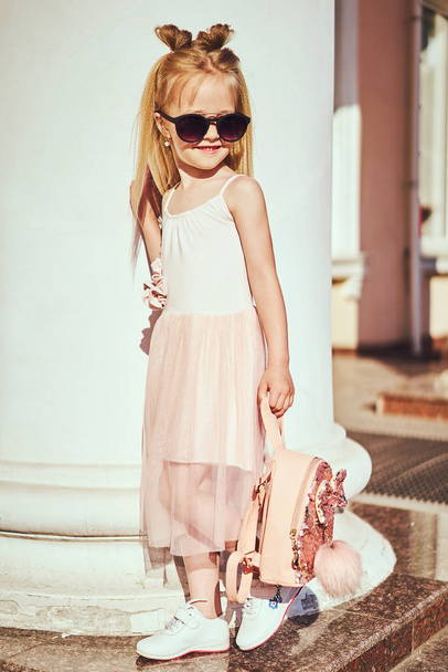 Adorable toddler girl wearing pink dress. Fashion portrait - Valokuva, kuva
