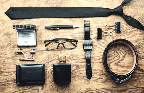 Men's accessories on the wood background. - 写真・画像