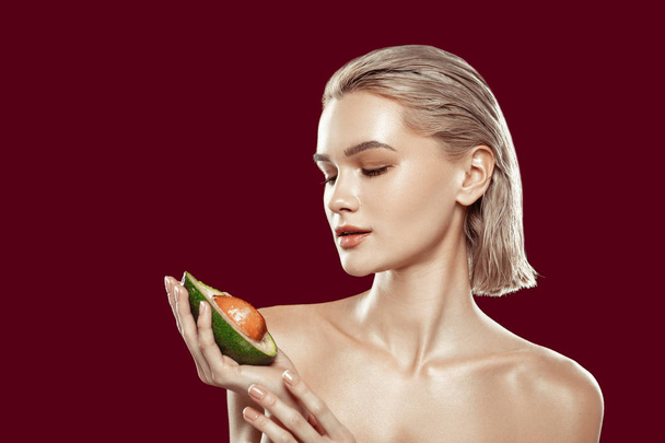 Slim model posing with avocado participating in health campaign - Foto, immagini