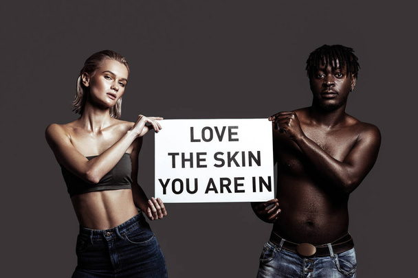 Slim model standing near her African-American boyfriend - Fotografie, Obrázek