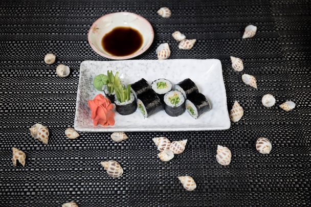 Japanese sushi set with ready to serve. Beautiful eastern style table decoration with sushi. Selective focus - Foto, Bild