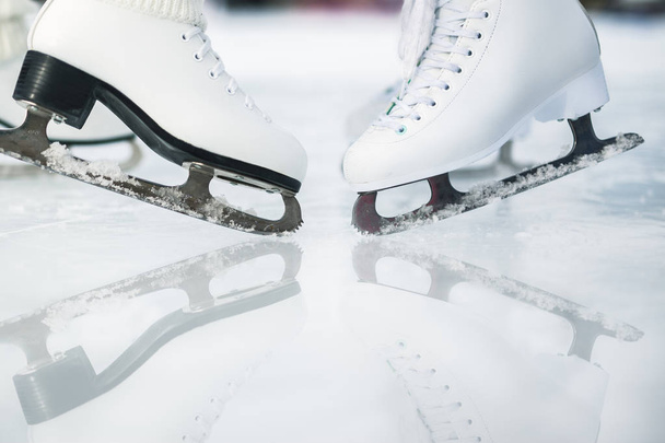 Closeup skating shoes ice skating outdoor at ice rink - Fotografie, Obrázek