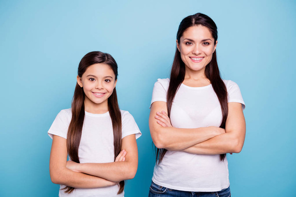 Close up photo pretty two people brown haired mum small little daughter crossed arms self-confidently standing ready win winner family competitions wear white t-shirts isolated bright blue background - Fotografie, Obrázek