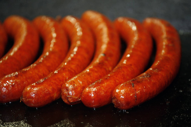 Closeup of traditional hungarian pork sausages for sale on farmers market - Foto, afbeelding