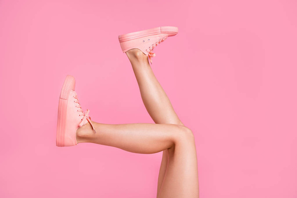 Cropped image view photo of nice attractive feminine girlish long fit slim thin shaven legs active sport walk go funny steps comfort zone isolated over pink pastel background - Foto, imagen