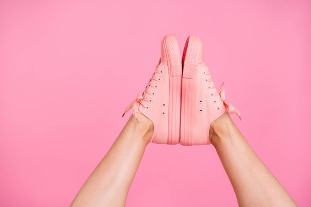 Cropped close-up image view photo of nice cool girlish legs active sport walk go cozy comfort zone footgear sale discount high quality soles together isolated over pink pastel background - Foto, imagen