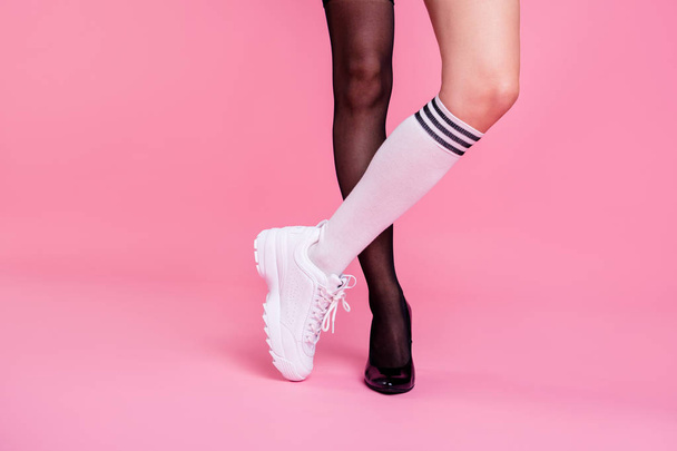 Cropped close-up view image concept photo of two girlish feminine attractive different fit thin slim legs cozy comfort luxury chic sporty comparison rest relax isolated on pink pastel background - Foto, Imagem