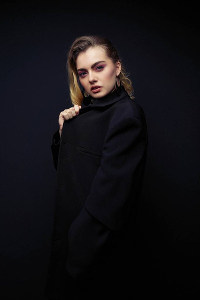 Beautiful Young Woman Posing  in black jacket                 - Foto, imagen