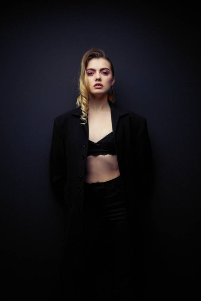 Beautiful Young Woman Posing  in black jacket  and bra - Photo, image
