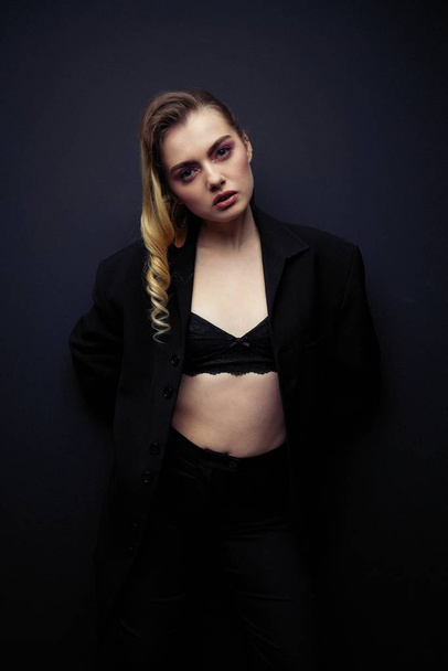 Beautiful Young Woman Posing  in black jacket  and bra - Foto, afbeelding