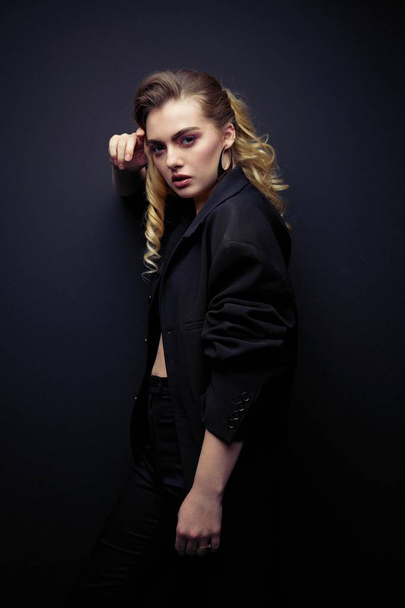  Beautiful Young Woman Posing  in black jacket                 - Foto, afbeelding