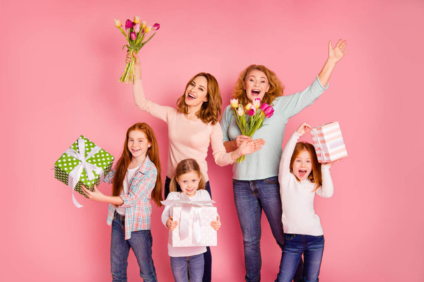 Close up photo ginger foxy little girls mom granny visit party bring bouquet big gift boxes visit party yeah screaming shouting amazed wear sweaters shirts pullovers isolated on rose background - Zdjęcie, obraz