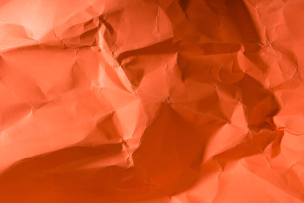 crumpled paper textured coral surface, color of 2019 concept - Photo, Image