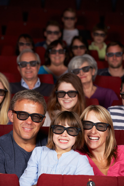 Family Watching 3D Film In Cinema - 写真・画像