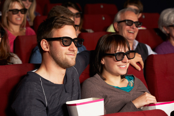 Couple Watching 3D Film In Cinema - Photo, image