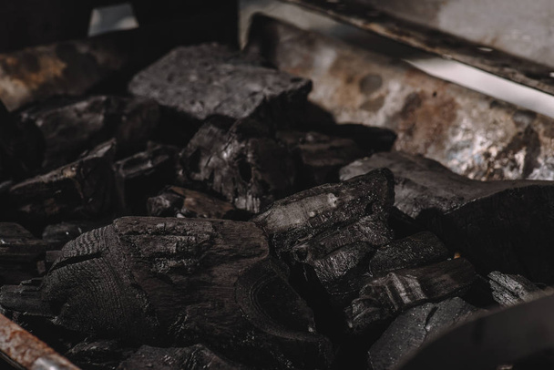 selective focus of dark black coals in barbecue  - Φωτογραφία, εικόνα